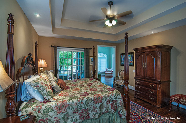 Tray ceiling and patio sliding glass door in the master bedroom. The Birchwood plan 1239.