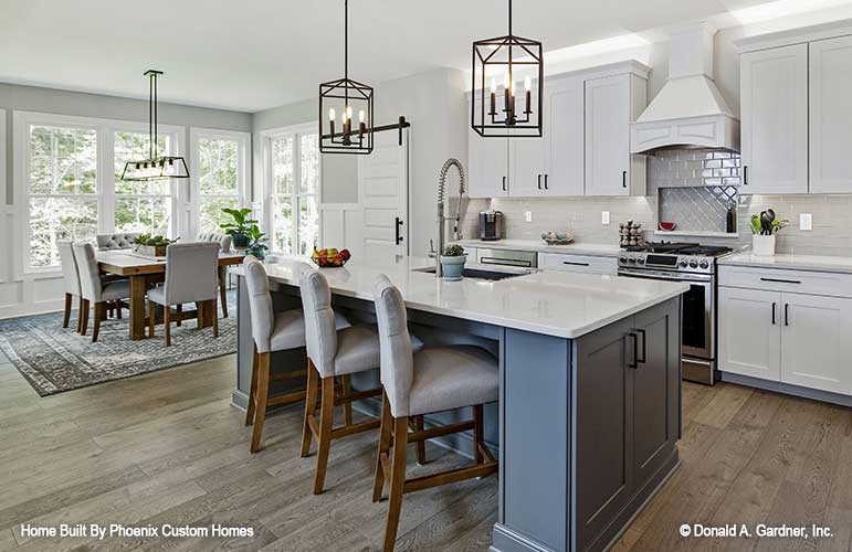 Full view of the kitchen island seating with the dining table off to the side. Blarney plan 1424 