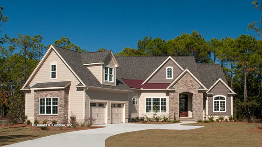 This is a photograph of the front of rustic house plan 1302 The Bluestone as built by a customer