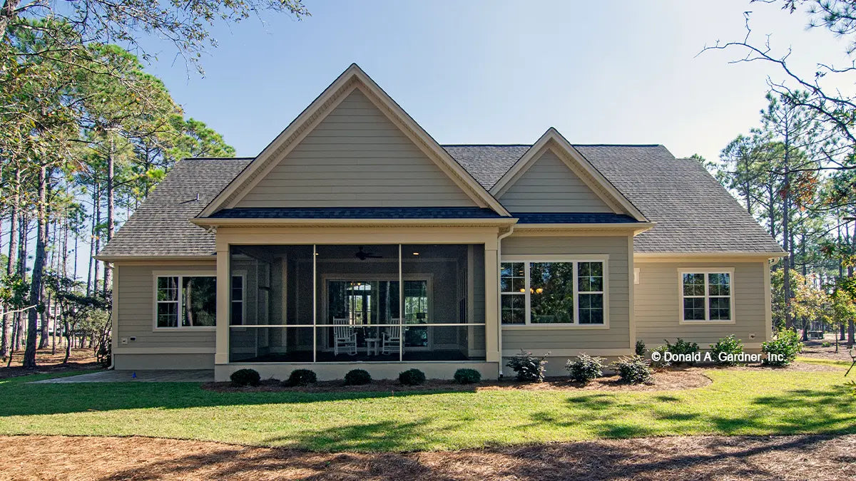 This is a photograph of the rear of cottage house plan 1302 The Bluestone as built by a customer