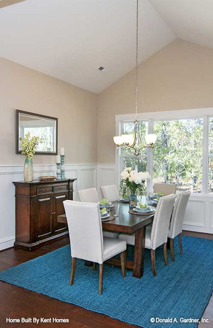 Dining room with cathedral ceiling of cottage house plan 1302 The Bluestone