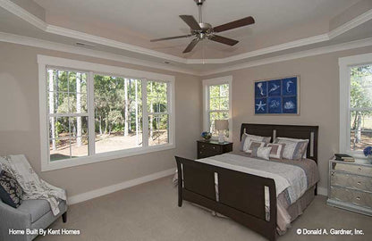 Master bedroom with tray ceiling pictured for cottage house plan 1302 The Bluestone