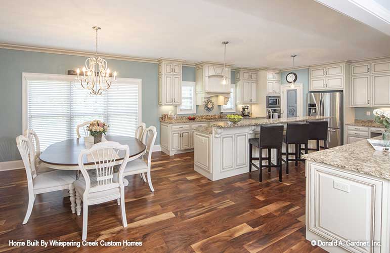 Breakfast nook and kitchen layout picture for house plan 1343 The Braxton