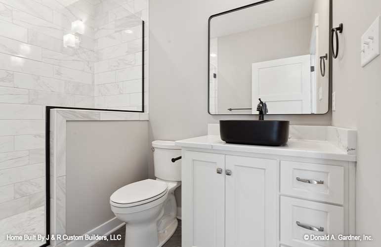 Single sink vanity and walk-in shower in the bathroom. The Brielle plan 1233.