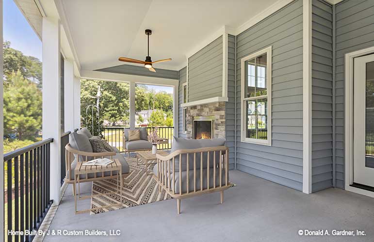 Outdoor fireplace on the rear porch. The Brielle plan 1233.