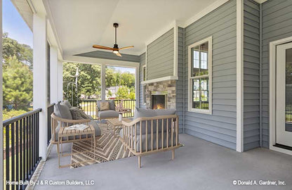 Outdoor fireplace on the rear porch. The Brielle plan 1233.