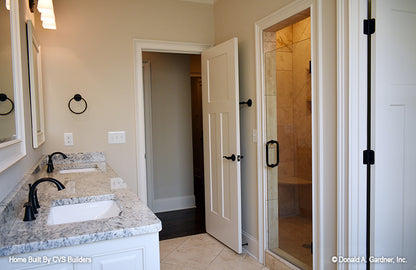 Double sink vanity across from the walk-in shower in the master bathroom. The Brogan plan 947.