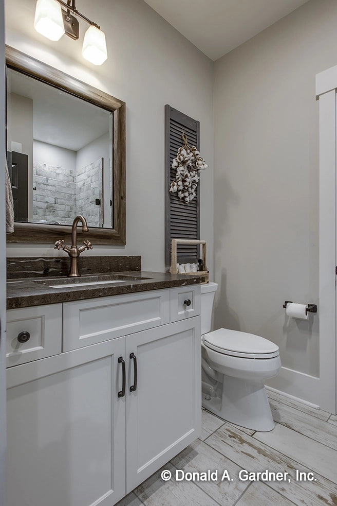 Bathroom with vanity and water closet