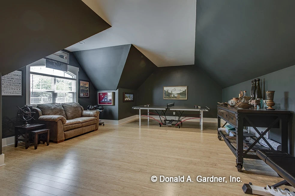 Bonus room over the garage with large window and hard wood floors