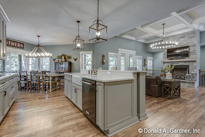 Island kitchen with farmers sink is open to the great room and the breakfast nook