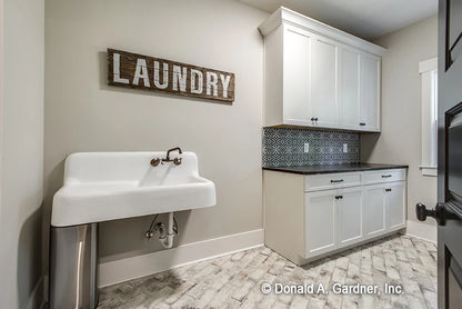 Laundry room with lots of counter space and huge utility sink