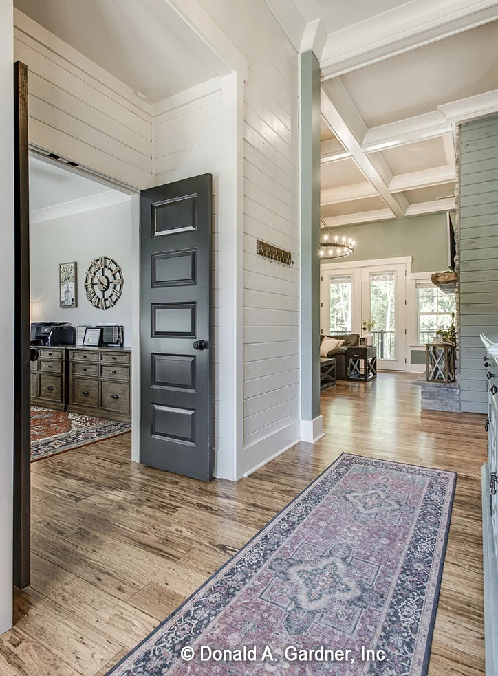 View from the foyer showing the great room and the double doors into the office