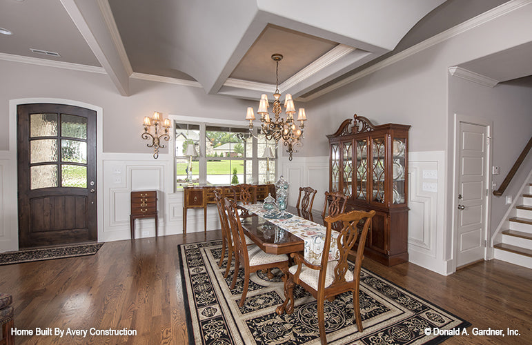 This is a picture of the dining room of the traditional house plan 1141 The Calypso