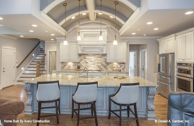 This is a picture of the island seating area in the kitchen of the traditional house plan 1141 The Calypso