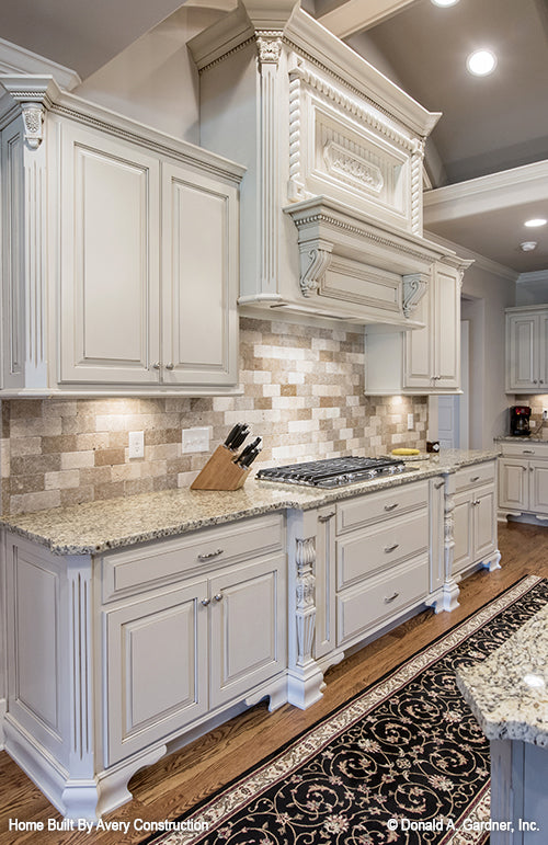 This is a picture of the counter and cooktop of the kitchen of the traditional house plan 1141 The Calypso