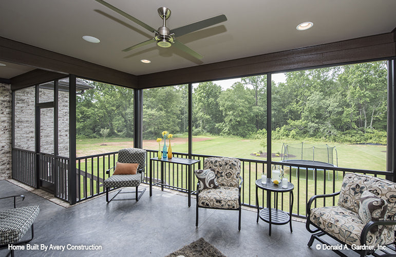 This is a picture of the screened porch of the traditional house plan 1141 The Calypso