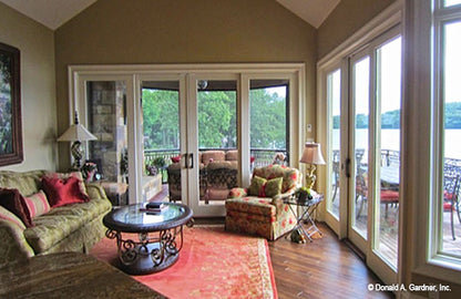 Glass French doors in the hearth room. The Capistrano plan 1227.