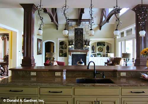 Bar ledge above the kitchen sink with hanging pendant lighting above. The Capistrano plan 1227.