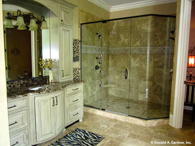 Single sink vanity next to the walk-in shower in the master bathroom. The Capistrano plan 1227.