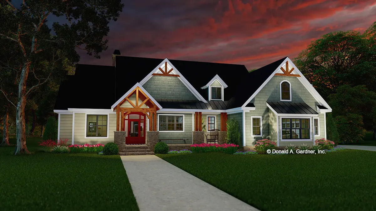 This is an illustration of the front of ranch house plan 1439 The Carden at dusk