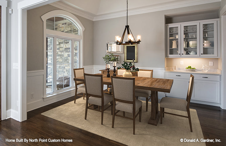 This is a dining room picture of the front of one story house plan 1180 The Carinthia