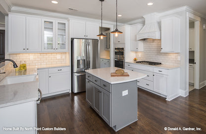 This is a kitchen with island picture of the front of one story house plan 1180 The Carinthia