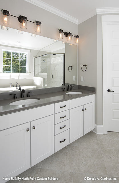 This is a master bathroom vanity picture of the front of one story house plan 1180 The Carinthia