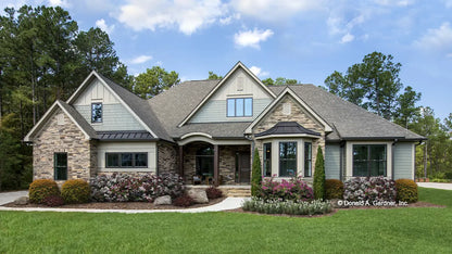 This is a photograph of the front of one story house plan 1180 The Carinthia as built by a customer