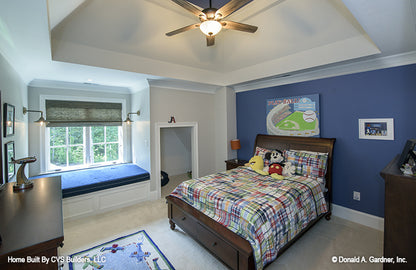 Tray ceiling and window bench seating in the secondary bedroom. The Carrera plan 1178.