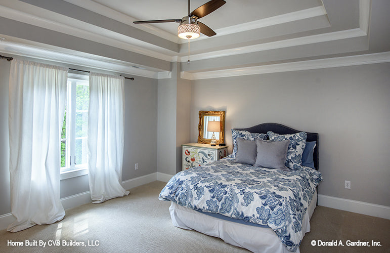 Tray ceiling and ceiling fan in the secondary bedroom. The Carrera plan 1178.