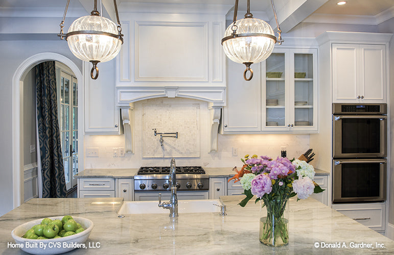 Marble counter tops in the kitchen. The Carrera plan 1178.