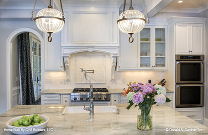 Marble counter tops in the kitchen. The Carrera plan 1178.