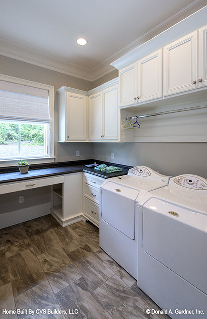 White cabinets in the utility room. The Carrera plan 1178.