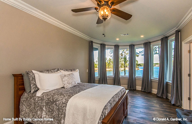 Curved wall with windows in the bedroom. The Cedar Court plan 5004.