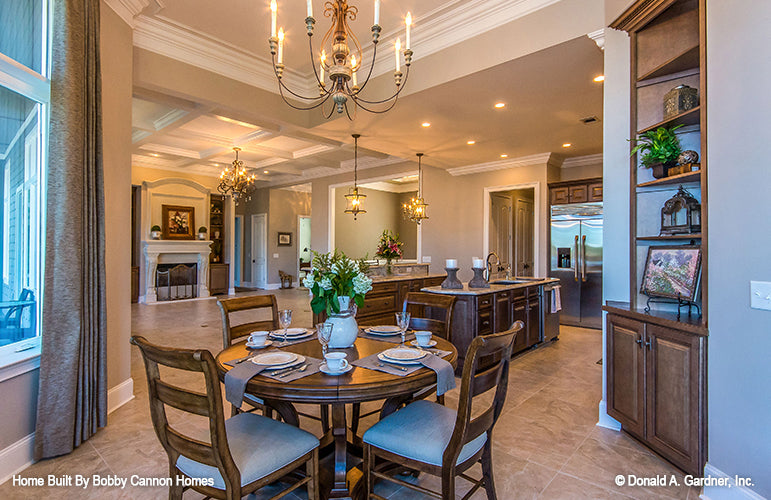 Chandelier in the breakfast nook and view into the kitchen. The Cedar Court plan 5004.