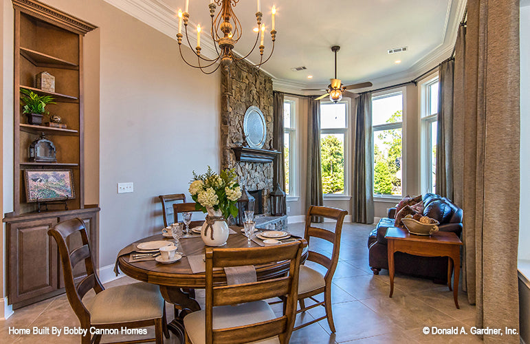 Floor to ceiling stone fireplace off the breakfast room. The Cedar Court plan 5004.