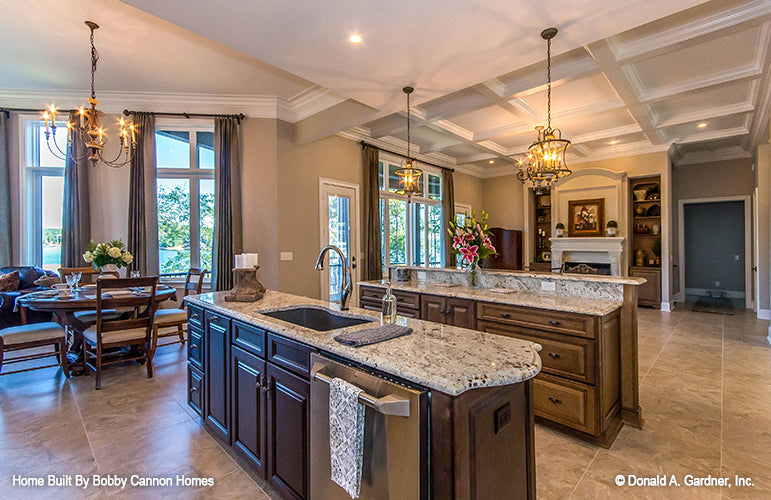 Island with a sink and dishwasher in the kitchen. The Cedar Court plan 5004.