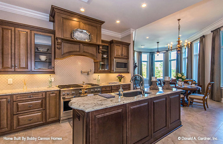 Stainless-steel appliances in the kitchen. The Cedar Court plan 5004.