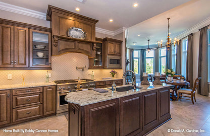 Stainless-steel appliances in the kitchen. The Cedar Court plan 5004.