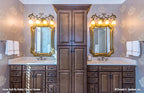 Two vanities separated by cabinets in the master bathroom. The Cedar Court plan 5004.