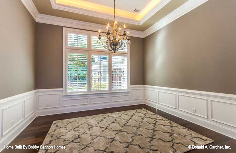 Tray ceiling and chandelier in the dining room. The Cedar Court plan 5004.