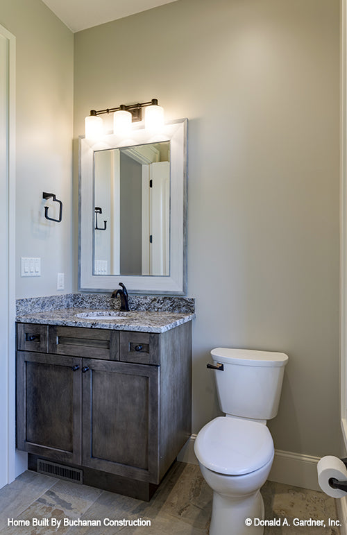 Powder room with single sink vanity. The Cedar Creek plan 959 