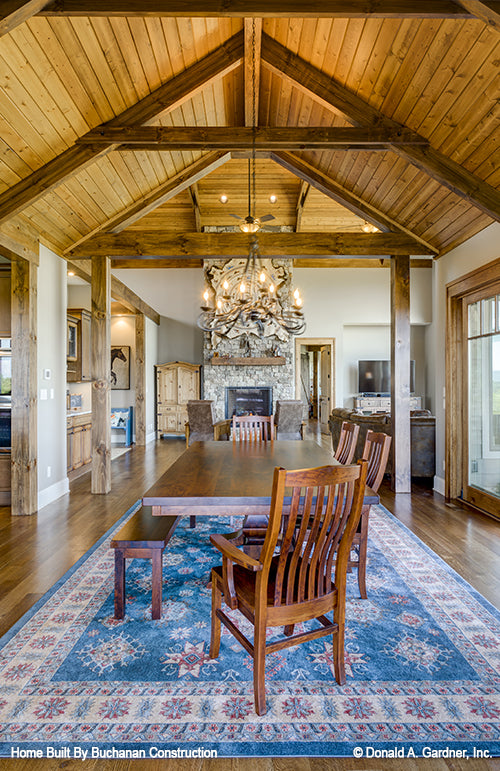 Dining room with wood paneling vaulted ceiling. The Cedar Creek plan 959 