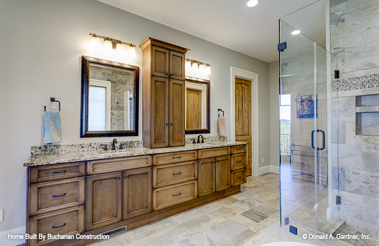 Double sink vanity in the master bathroom across from the walk-in shower. The Cedar Creek plan 959 