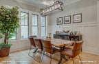 Dining room with windows and coffered ceiling for one story house plan 1323 The Celeste