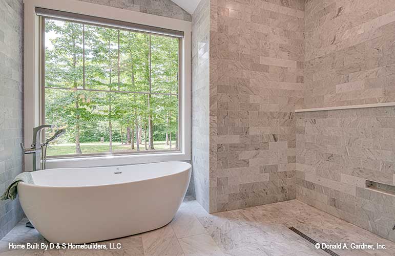 Elegant master bath with tub pictured for one story house plan 1323 The Celeste