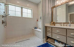 Elegant master bathroom pictured with vanity for one story house plan 1323 The Celeste