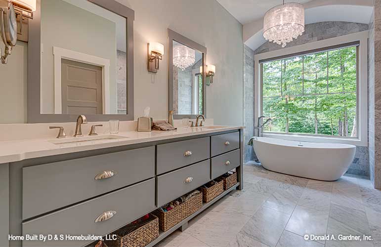 Master bath with double sink vanity pictured for one story house plan 1323 The Celeste