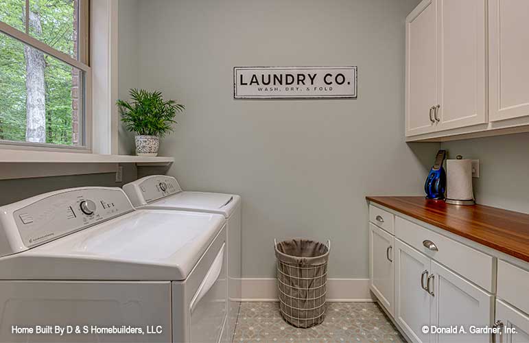 Roomy utility room for one story house plan 1323 The Celeste