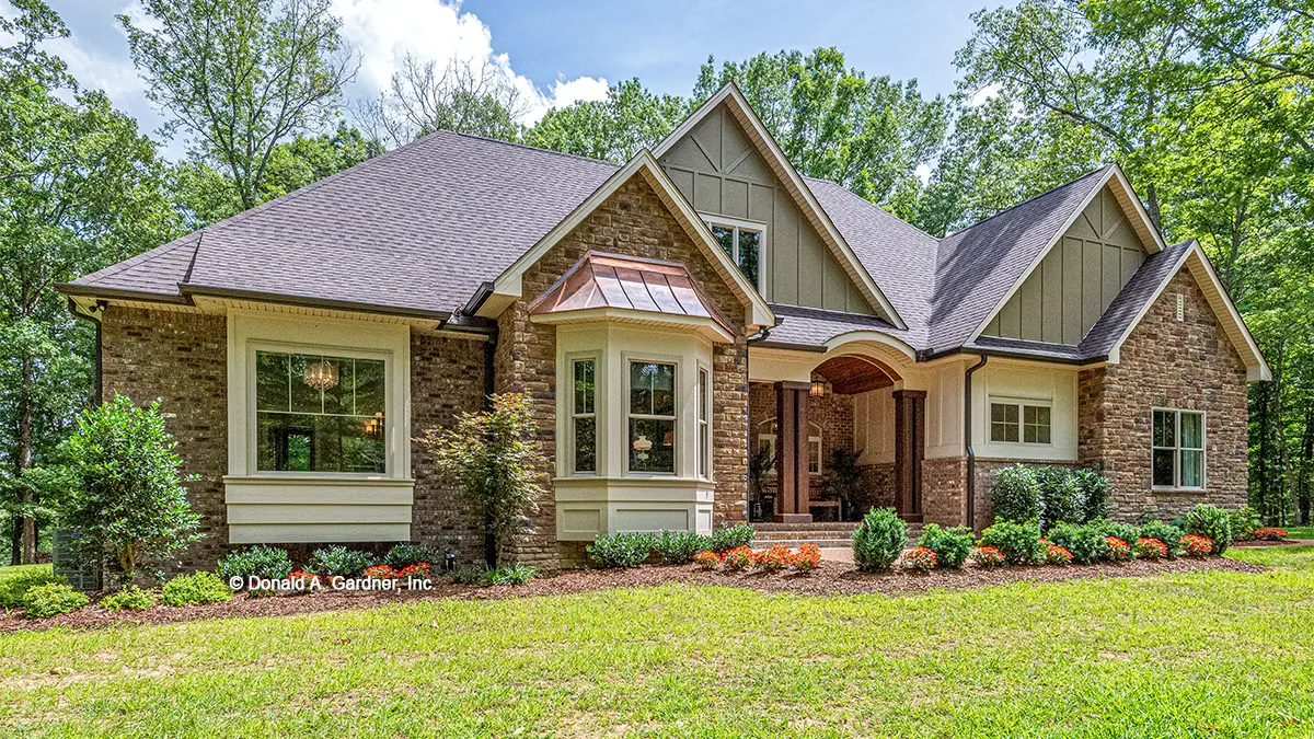 This is a photograph of the front of European house plan 1323 The Celeste as built by a customer